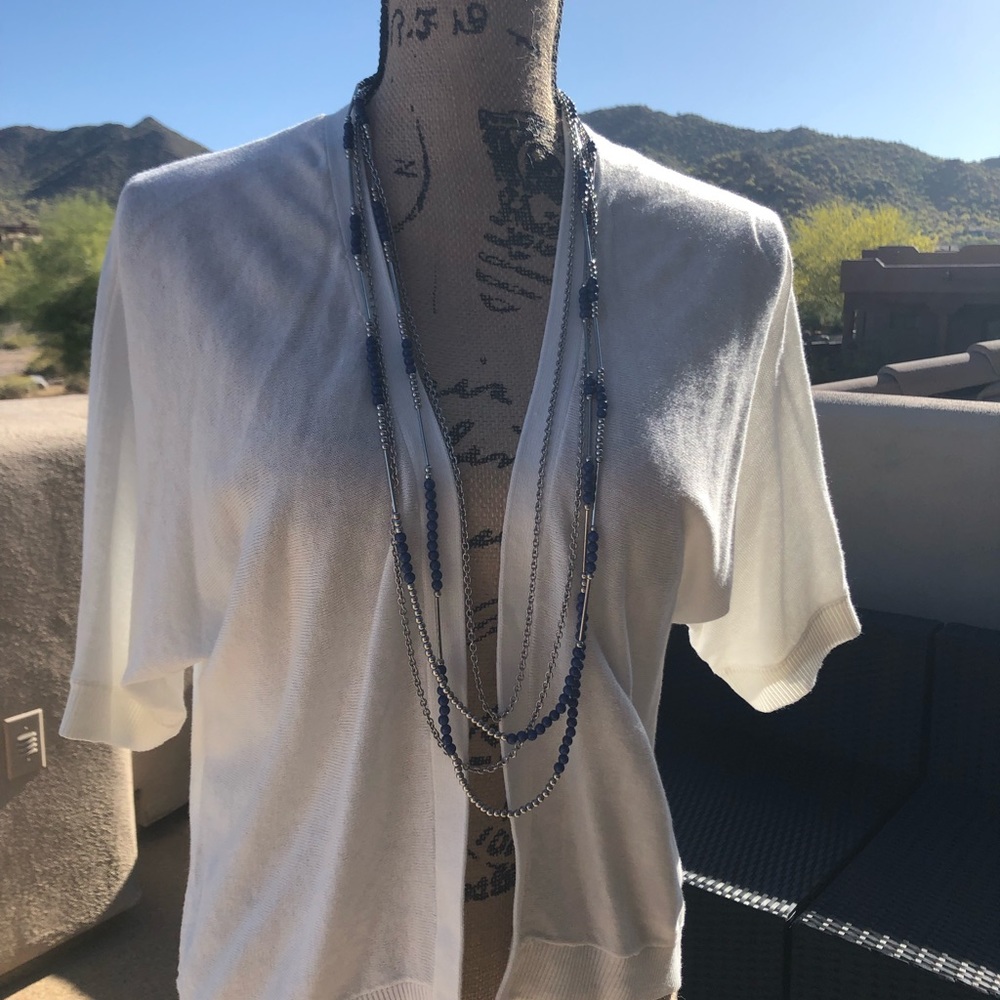 Short sleeve white open cardigan. Not a sweater.